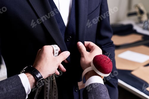 Preview: Close Up of Tailor Working on Suit