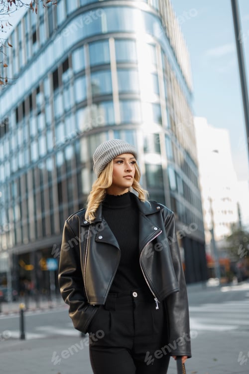 Preview: Woman in Leather Jacket and Hat in City