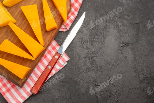 Preview: top view fresh sliced cheese on dark-grey background meal photo cips color food