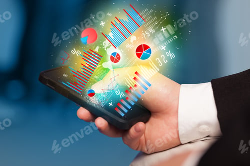 Preview: Business Man Holding Smartphone With Chart Symbols Concept