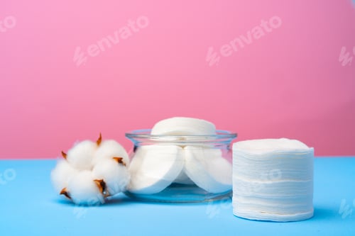 Preview: Cotton flower and cotton discs on paper background