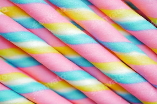 Preview: colorful wafer roll chocolate on pink background