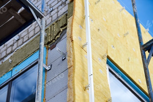 Preview: office building under construction. Facing and insulation of walls