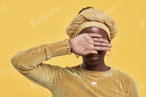 Preview: African American Woman Covering Face on Yellow