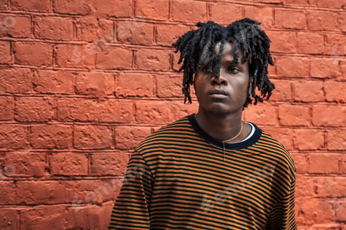 Preview: Portrait of young handsome stylish black man with natural hair dreadlocks. Afroamerican guy. Red bri