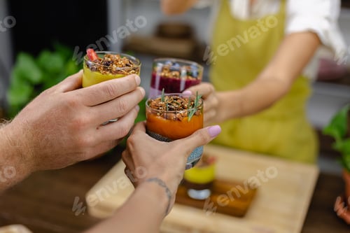 Preview: Colorful healthy breakfast sweet deserts few different chia puddings in glass jars