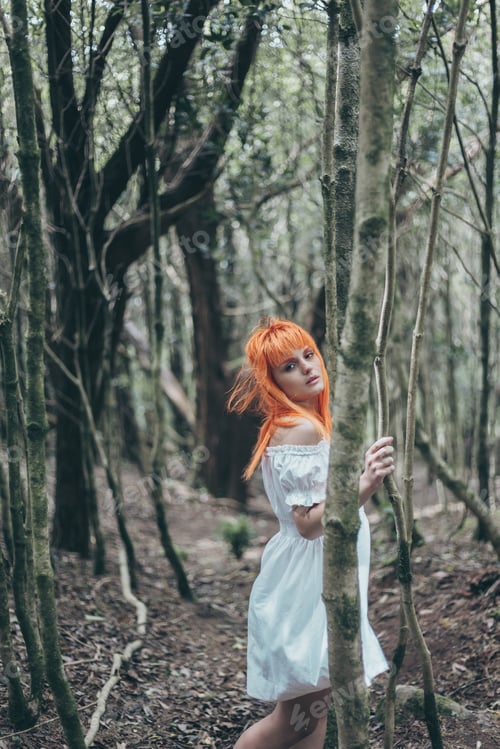 Preview: Young woman with white dress on forest