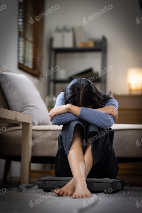 Preview: Unhappy lonely depressed Upset woman at home, she is sitting on the couch at home, feeling despair a