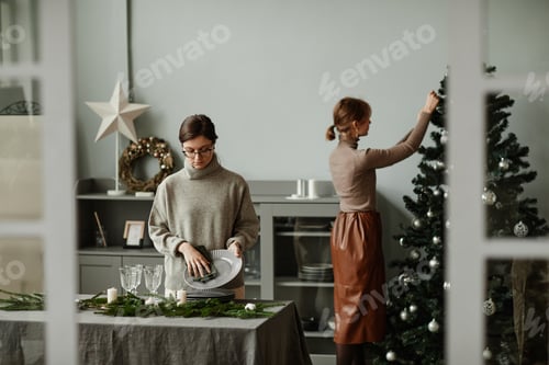 Preview: Women Preparing Dining Room for Christmas