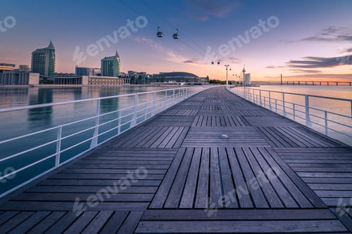 Preview: Wooden pier on the water at sunset in Lisbon, Portugal