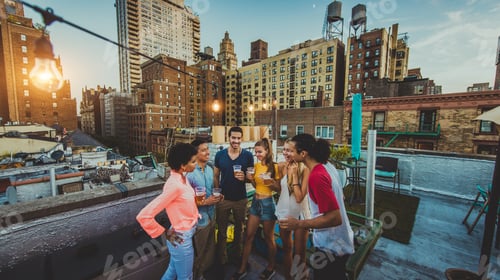 Preview: Group of friends having party on a rooftop