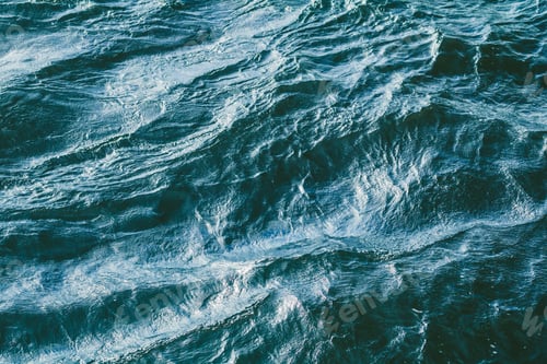 Preview: Top view of stormy sea. Blue water backround.