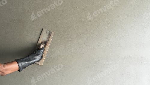 Preview: Cement wall, Hand worker Plastering wet Cement Background with handle brush