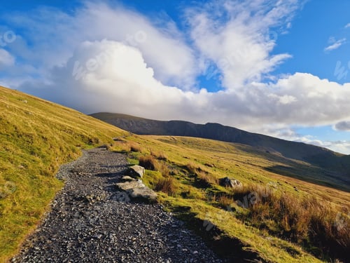 Preview: Natural view of a trail on an autumnal mountain landscape on a sunny day