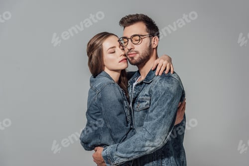 Preview: Affectionate Couple Embracing in Denim Jackets