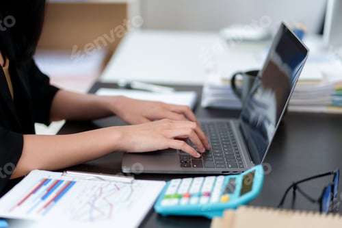 Preview: Close-up of business woman typing on his laptop computer in the office.