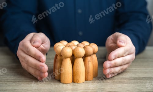 Preview: A man protects human figures with his hands.