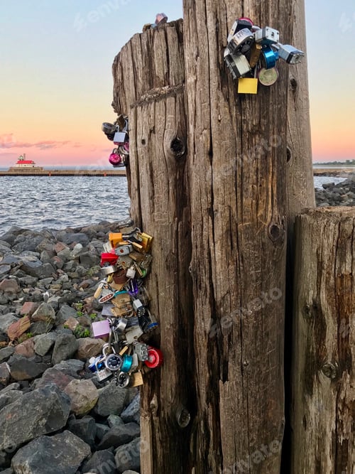 Preview: The Love Locks in Duluth, Minnesota with sunset and lighthouse in background
