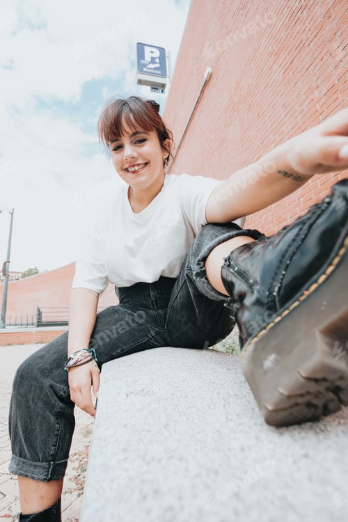 Preview: Outdoor lifestyle portrait of pretty red head young girl, wearing white tshirt and militar boots