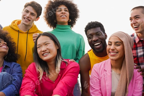 Preview: Happy multiracial young people having fun together outdoor