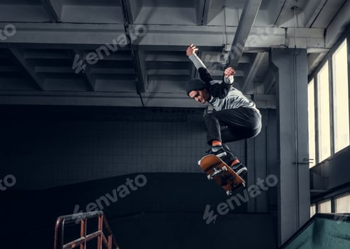 Preview: Young skateboarder at skate park indoor