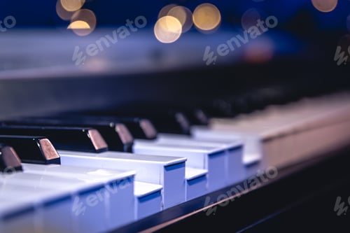 Preview: Piano keys close-up on a blurred background with bokeh.