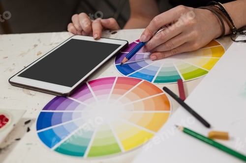 Preview: Close-up of woman matching color with color swatch