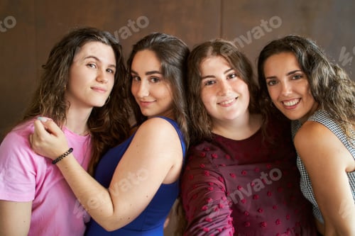 Preview: four smiling friends taking a selfy