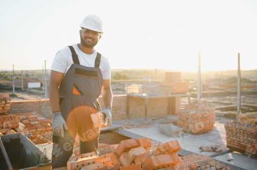 Preview: Indian Construction worker in uniform and safety equipment have job on building
