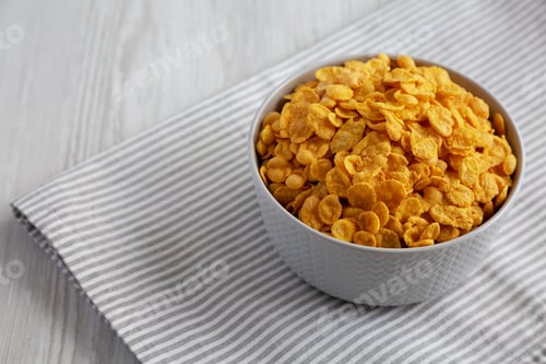 Preview: Tasty Corn Flakes in a Bowl, side view. Copy space.