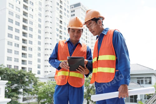 Preview: Civil engineers checking data on tablet