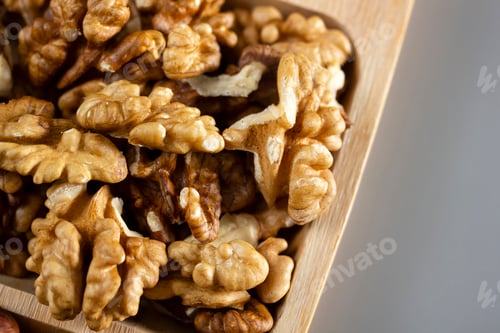 Preview: walnuts in a wooden plate