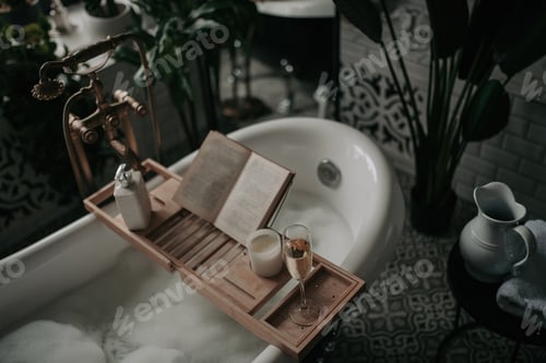 Preview: Luxury interior of eco style modern bathroom with oval bathtub and book on bamboo wood tray