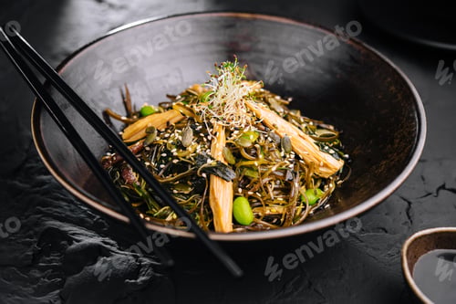 Preview: Spicy dish, noodles with meat and vegetables in wok pan