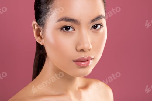 Preview: Closeup of topless pretty asian woman on purple studio background