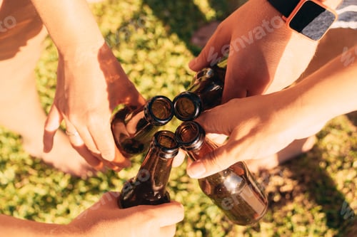 Preview: Closeup shot of hands holding bottles