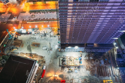 Preview: Development Multistorey Residential Building in night hours. development on construction site. night
