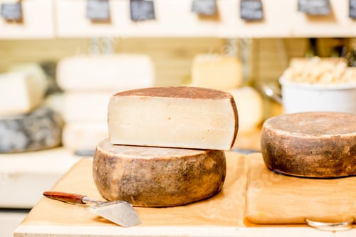 Preview: Seasoned cheese with slicer on the table