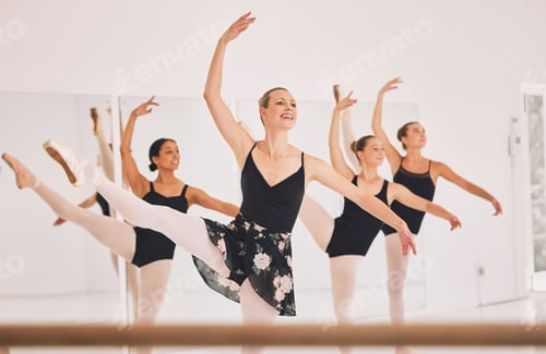 Preview: Young woman dance instructor teaching a ballet class to a group of a children in her studio. Baller