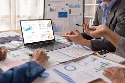 Preview: Group of confident business people point to graphs and charts to analyze market data, balance sheet,