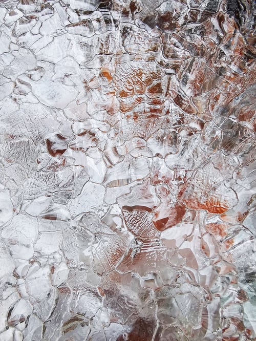 Preview: Closeup shot of details of the cracked ice texture in the wintertime