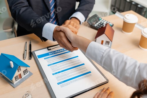 Preview: A real estate insurance agent and client shake hands