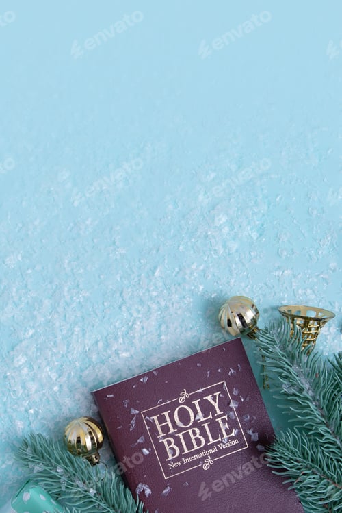 Preview: Holy bible and Christmas decor with snow. Christian winter background copy space