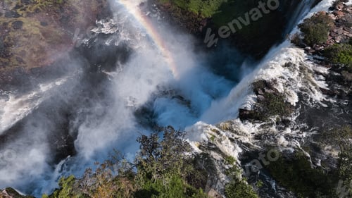 Preview: Majestic Kalandula Waterfall cascading down rocky cliffs in Angola