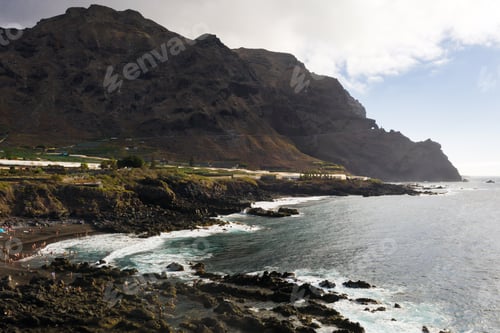 Preview: Volcanic black beach and Rough rocky cliffs on the island of Tenerife. Rocks, volcanic rock