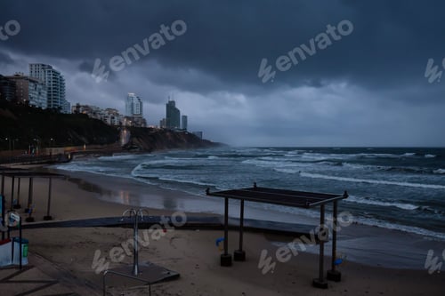 Preview: Sandy beach during a stormy sunrise