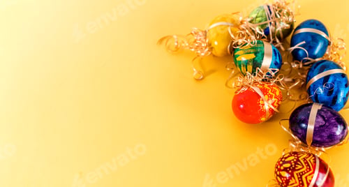 Preview: Close-up shot of a colorful Easter banner with Easter Egg on yellow background