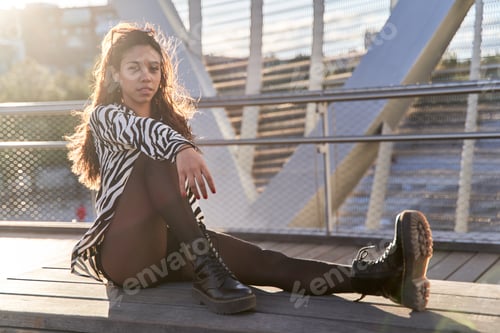 Preview: young modern latina posing facing the camera