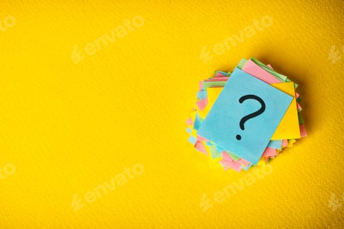 Preview: question marks written reminders tickets on yellow vintage paper background