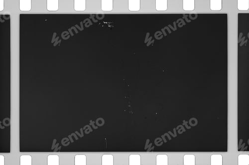 Preview: 35mm black and white negative film with blank exposed frame, perforations, scratches and grains.